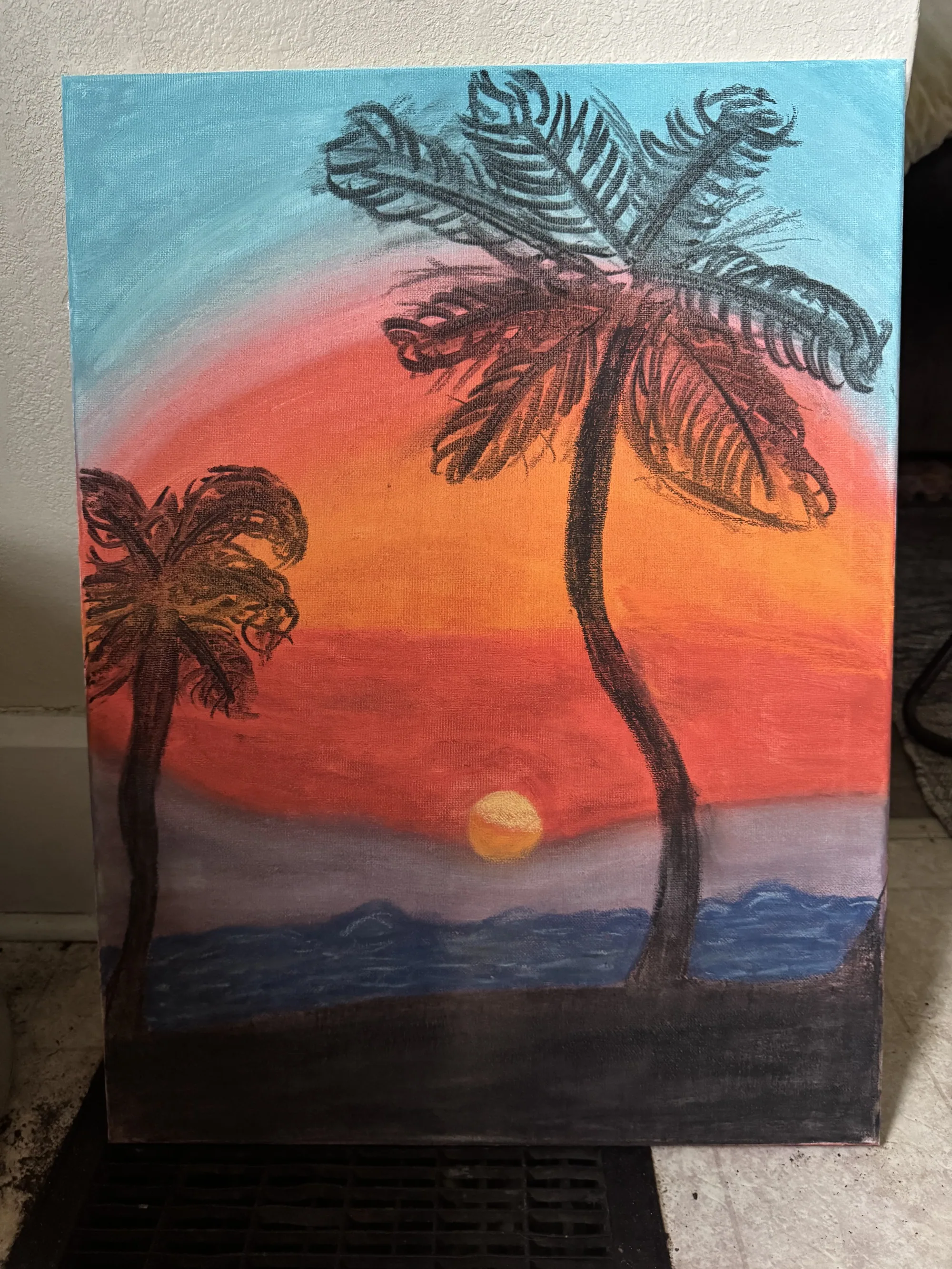 Acrylic painting of palm trees against a sunset sky